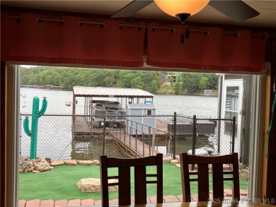 ***Huge PRICE REDUCTION*** Rare find *Level* Lakefront home sits