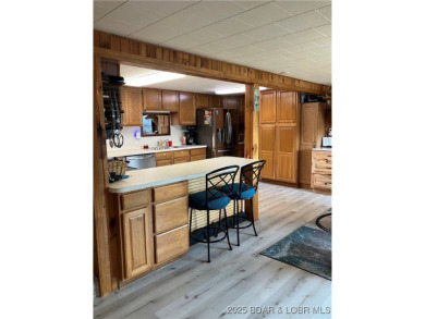 ***Huge PRICE REDUCTION*** Rare find *Level* Lakefront home sits