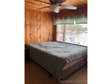 ***Huge PRICE REDUCTION*** Rare find *Level* Lakefront home sits