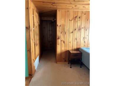 ***Huge PRICE REDUCTION*** Rare find *Level* Lakefront home sits