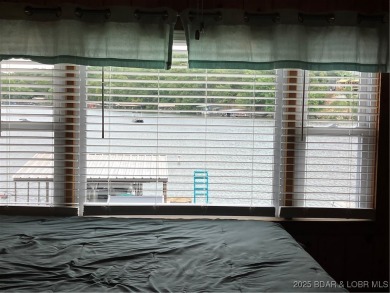 ***Huge PRICE REDUCTION*** Rare find *Level* Lakefront home sits