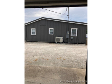 ***Huge PRICE REDUCTION*** Rare find *Level* Lakefront home sits