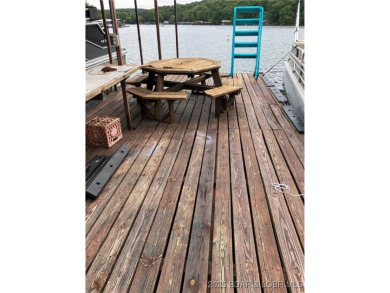 ***Huge PRICE REDUCTION*** Rare find *Level* Lakefront home sits