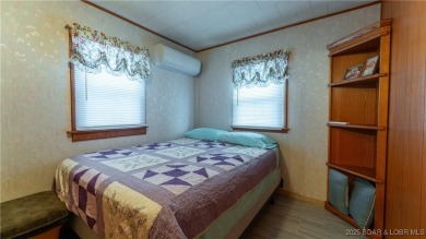 ***Huge PRICE REDUCTION*** Rare find *Level* Lakefront home sits