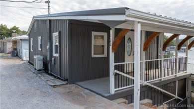 ***Huge PRICE REDUCTION*** Rare find *Level* Lakefront home sits