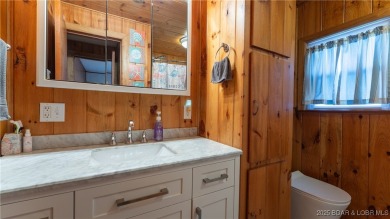 ***Huge PRICE REDUCTION*** Rare find *Level* Lakefront home sits