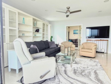 Step into the open-concept living space, where large sliding