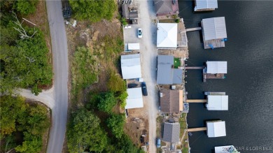 ***Huge PRICE REDUCTION*** Rare find *Level* Lakefront home sits