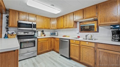 ***Huge PRICE REDUCTION*** Rare find *Level* Lakefront home sits