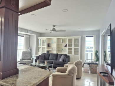 Step into the open-concept living space, where large sliding