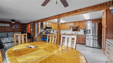 ***Huge PRICE REDUCTION*** Rare find *Level* Lakefront home sits