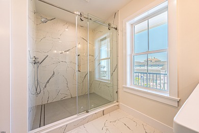 Just two blocks from the beach, this brand-new luxury