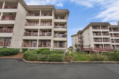 Step into coastal luxury at Admirals Row A1, a first-floor end