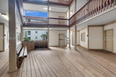 Step into coastal luxury at Admirals Row A1, a first-floor end