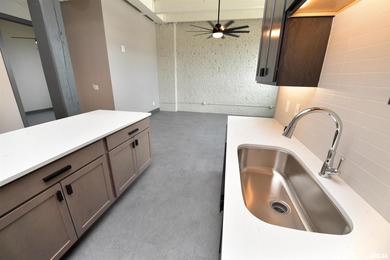 This impressive 2 bed/2 bath unit offers that historic warehouse