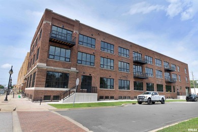 This impressive 2 bed/2 bath unit offers that historic warehouse