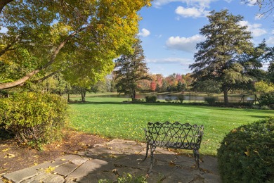 Exquisite and timeless, this custom one-acre estate commands one