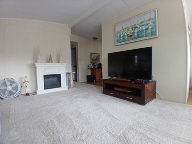 Welcome to this beautifully maintained doublewide mobile home