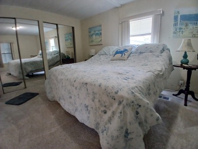 Welcome to this beautifully maintained doublewide mobile home