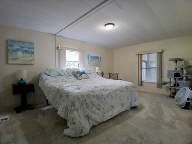 Welcome to this beautifully maintained doublewide mobile home