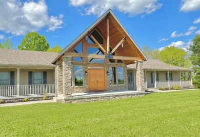 This beautiful and spacious, custom built A-frame ranch sets on