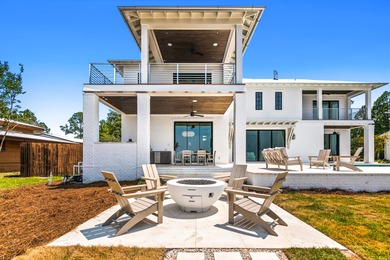 Introducing a stunning masterpiece of chic farmhouse bayfront