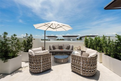 Coastal charm meets elevated elegance at this four-level, modern