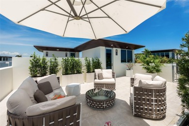 Coastal charm meets elevated elegance at this four-level, modern