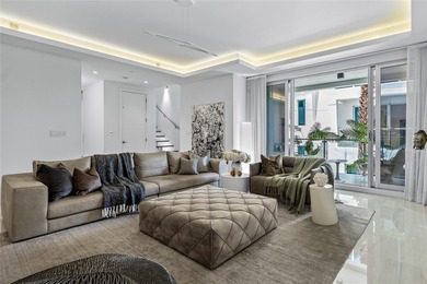 Coastal charm meets elevated elegance at this four-level, modern