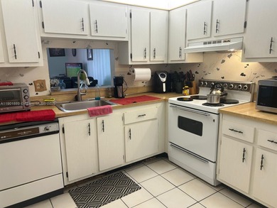 Beautiful corner unit located in a gated community offering