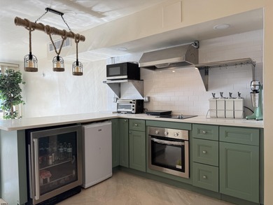 OCEANFRONT building offering an updated one-bedroom condo with