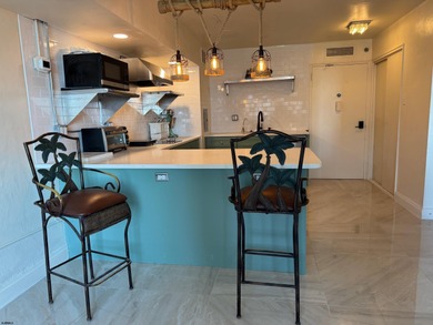 OCEANFRONT building offering an updated one-bedroom condo with