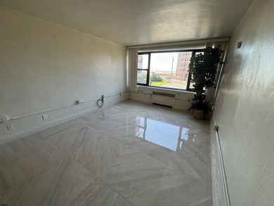 OCEANFRONT building offering an updated one-bedroom condo with