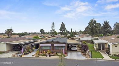 Tucked along a serene greenbelt within a gated 55+ community