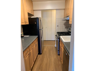 Recently updated 3rd floor unit with gleaming hardwood floors