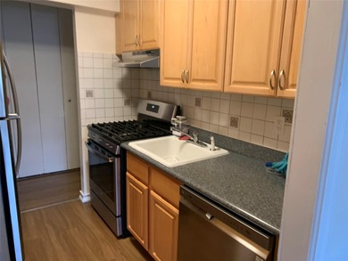 Recently updated 3rd floor unit with gleaming hardwood floors