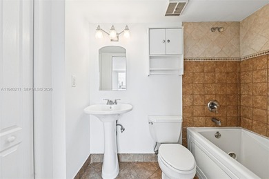 Welcome to this exceptional 2-bedroom, 2-bath condo perched on