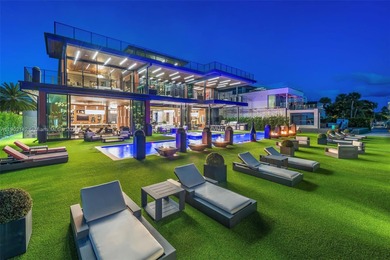 Welcome to 733 Middle River Drive in the gated community of