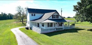 Move-in ready farmhouse on 10 acres, just two minutes from town