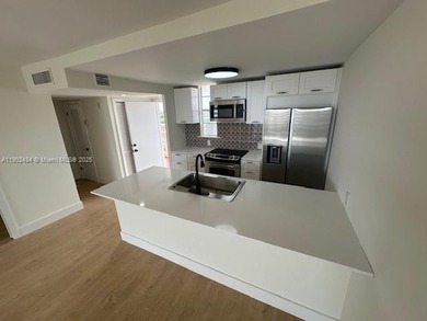 This beautifully and totally remodeled 55+ condo offers a