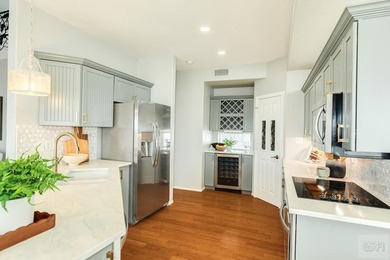 GORGEOUS custom-built home on Eckert Bayou and West Bay. This