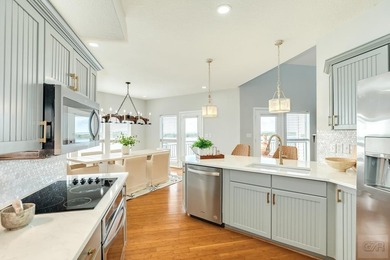 GORGEOUS custom-built home on Eckert Bayou and West Bay. This