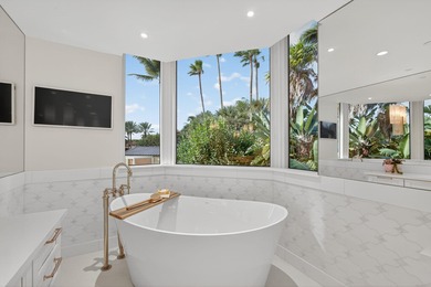 This spacious three-bedroom, three-bathroom first-floor Ocean