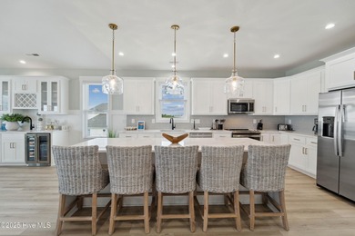 Oceanfront elegance meets coastal convenience in this stunning