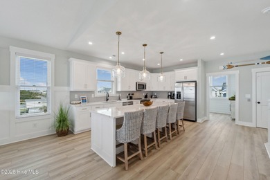 Oceanfront elegance meets coastal convenience in this stunning