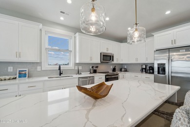 Oceanfront elegance meets coastal convenience in this stunning