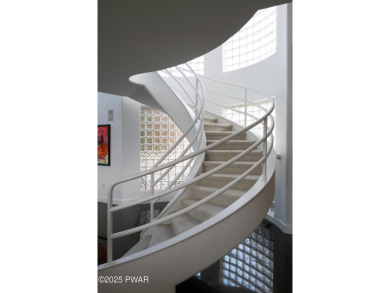 This striking three story, 7000+ square foot residence is