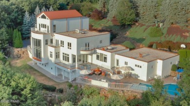 This striking three story, 7000+ square foot residence is