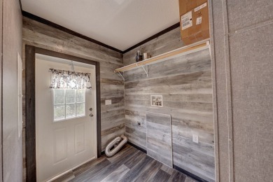 Enjoy country living and no city taxes minutes from town. This