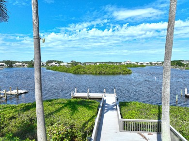 This stunning waterfront British West Indies-style home offers 5